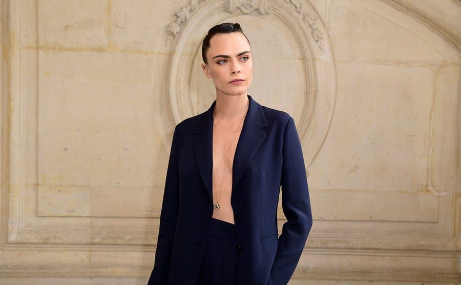 Cara Delevingne attends the Christian Dior Haute Couture show. 