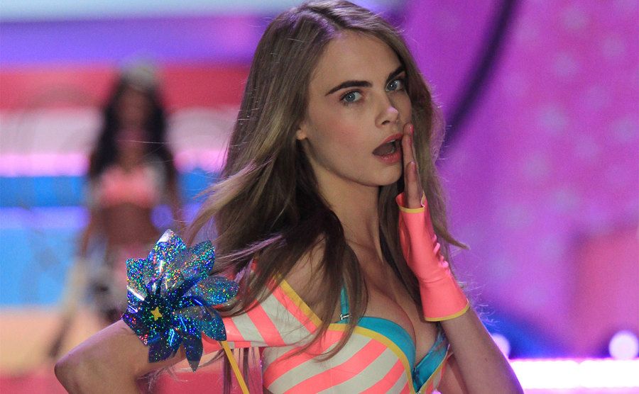 Cara Delevingne walks the runway during the Victoria's Secret Fashion Show. 