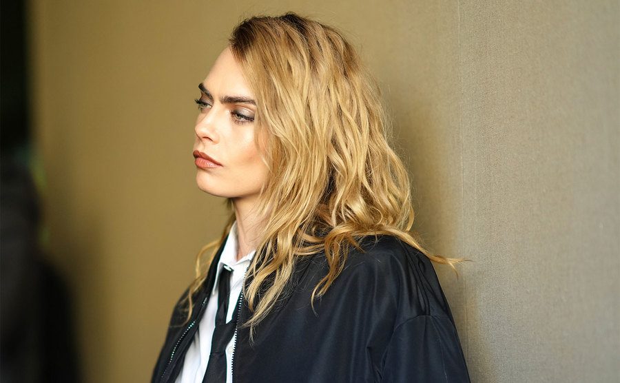 Cara Delevingne is lost in thought. 