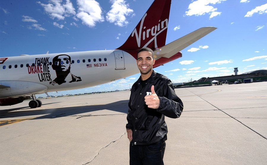 Drake poses in front of 