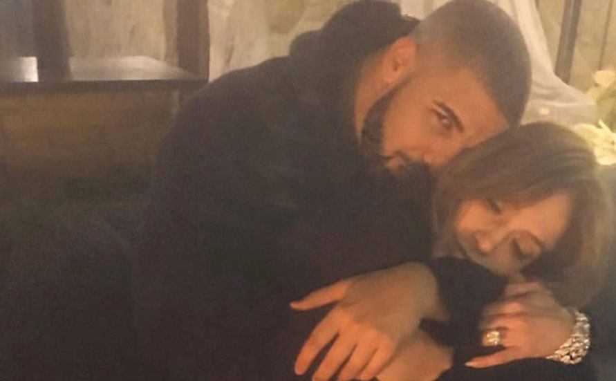 Drake embraces Jennifer Lopez at home. 