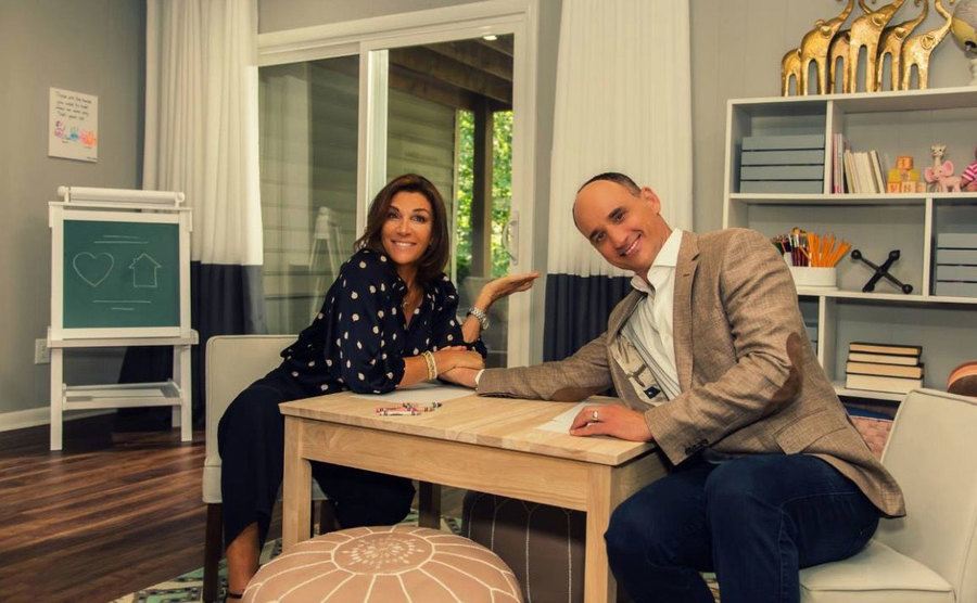 Hilary Farr and David Visentin sit in a playroom. 
