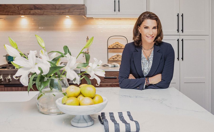 Hilary Farr poses in a remodeled kitchen. 