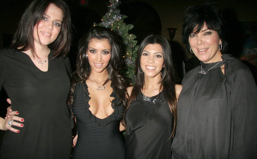 Khloe Kardashian, Kim Kardashian, Kourtney Kardashian, and Kris Jenner attend an event. 