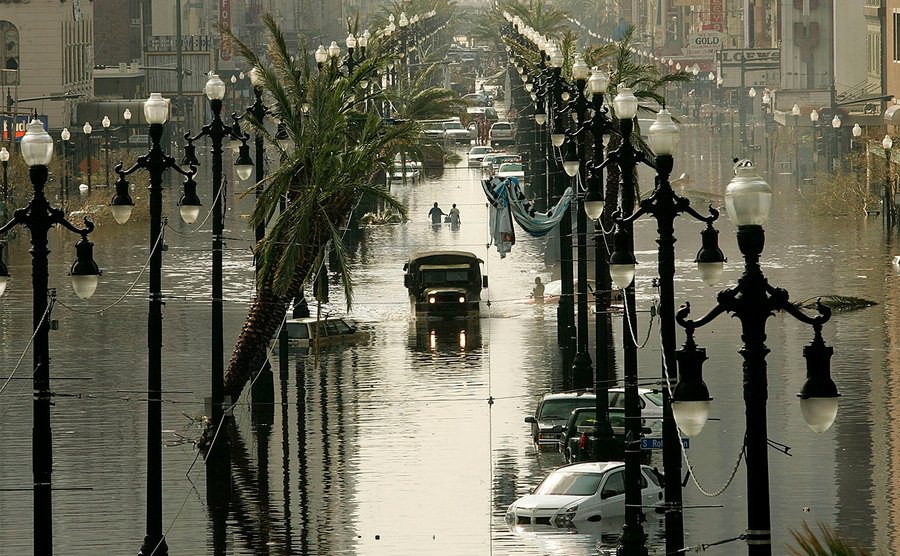 A Military truck drives down a flooded Canal St.