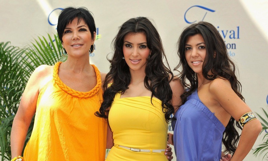 Kim Kardashian (C) with her mother Kris (L) and sister Kourtney